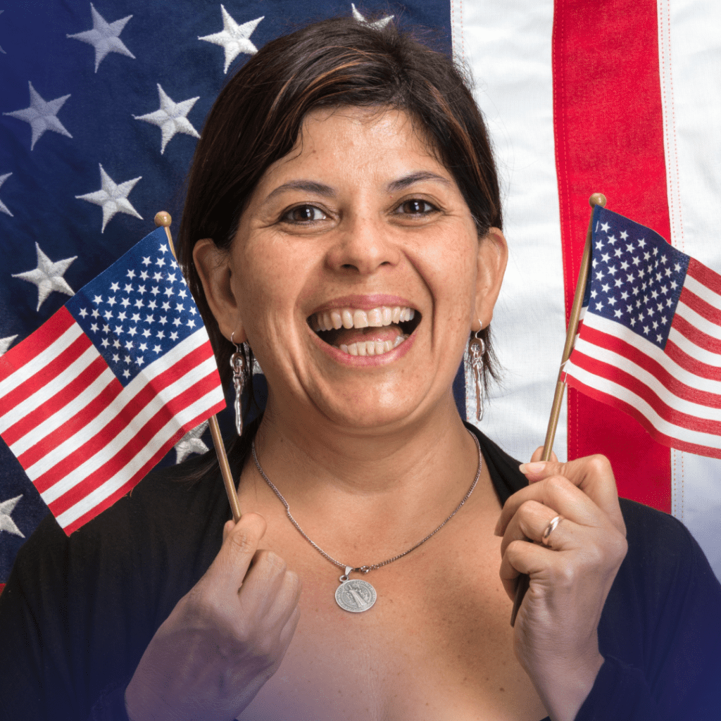A Woman Holding Up Two American Flags in Hand